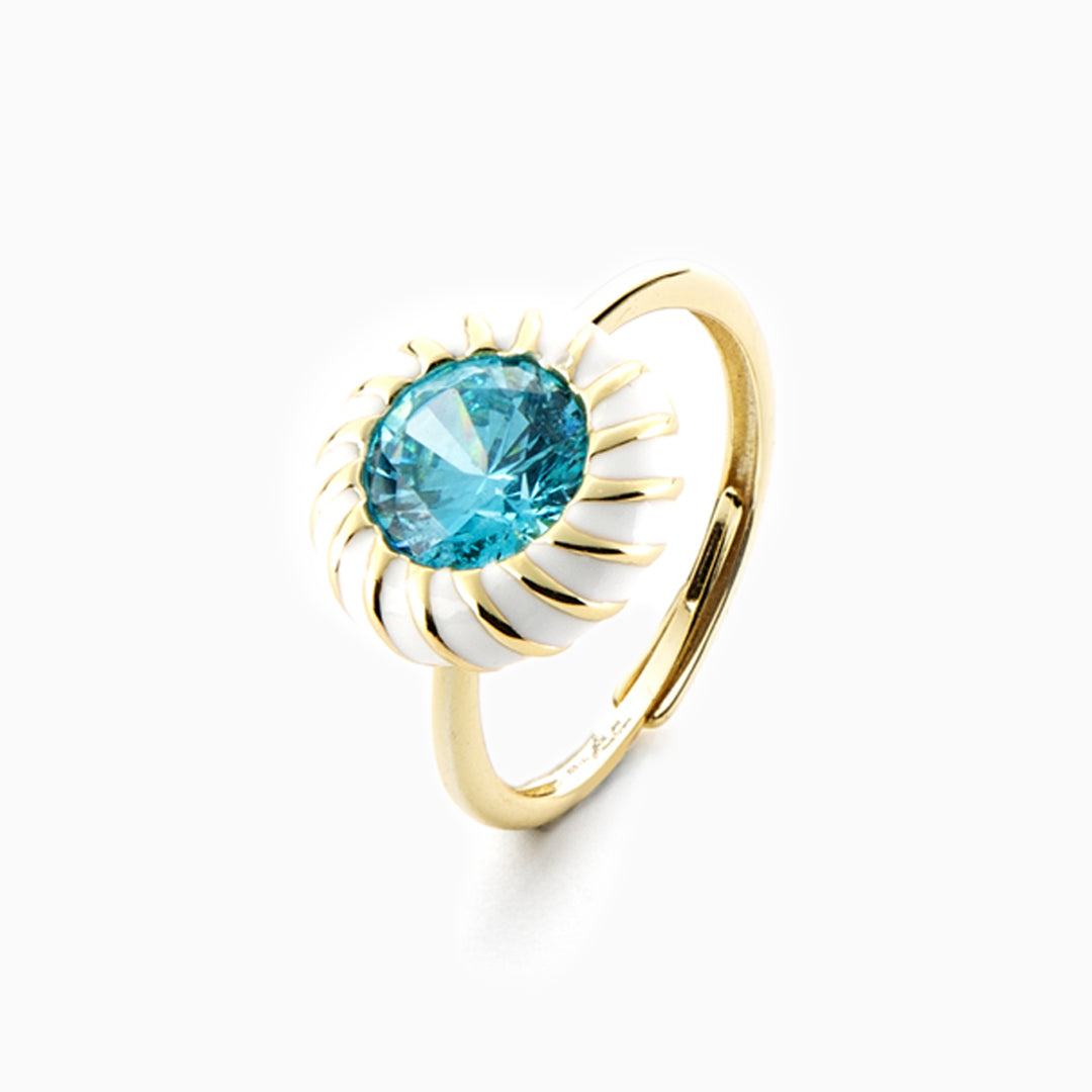 Anello in argento dorato con corona bianca e cristallo azzurro