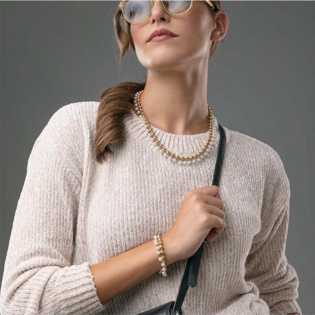 Bracciale in acciaio con sfere e perle pendenti
