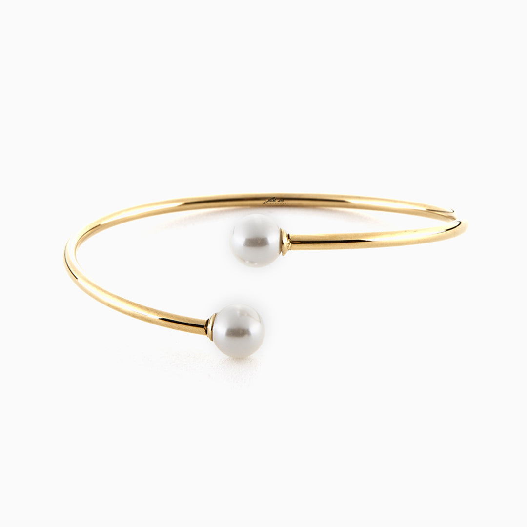Bracciale rigido dorato con perle bianche