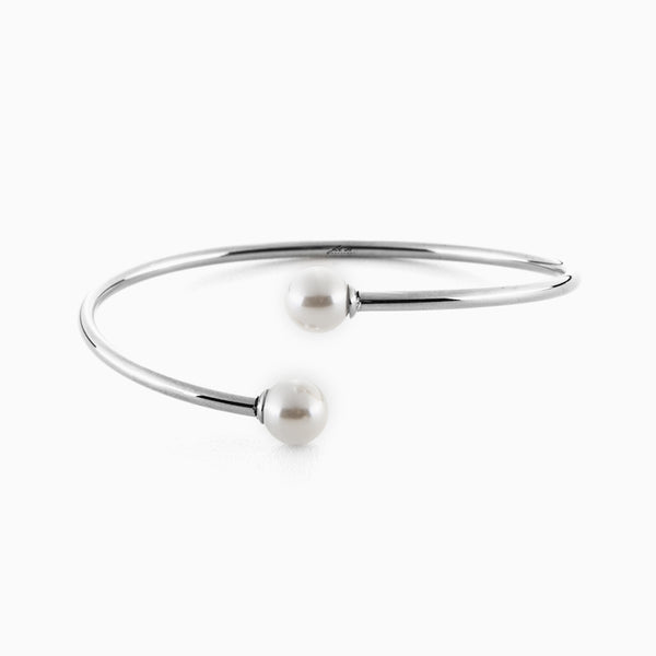 Bracciale rigido dorato con perle bianche
