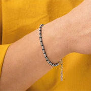 Bracciale in acciaio con rondelle bicolore nere e argento