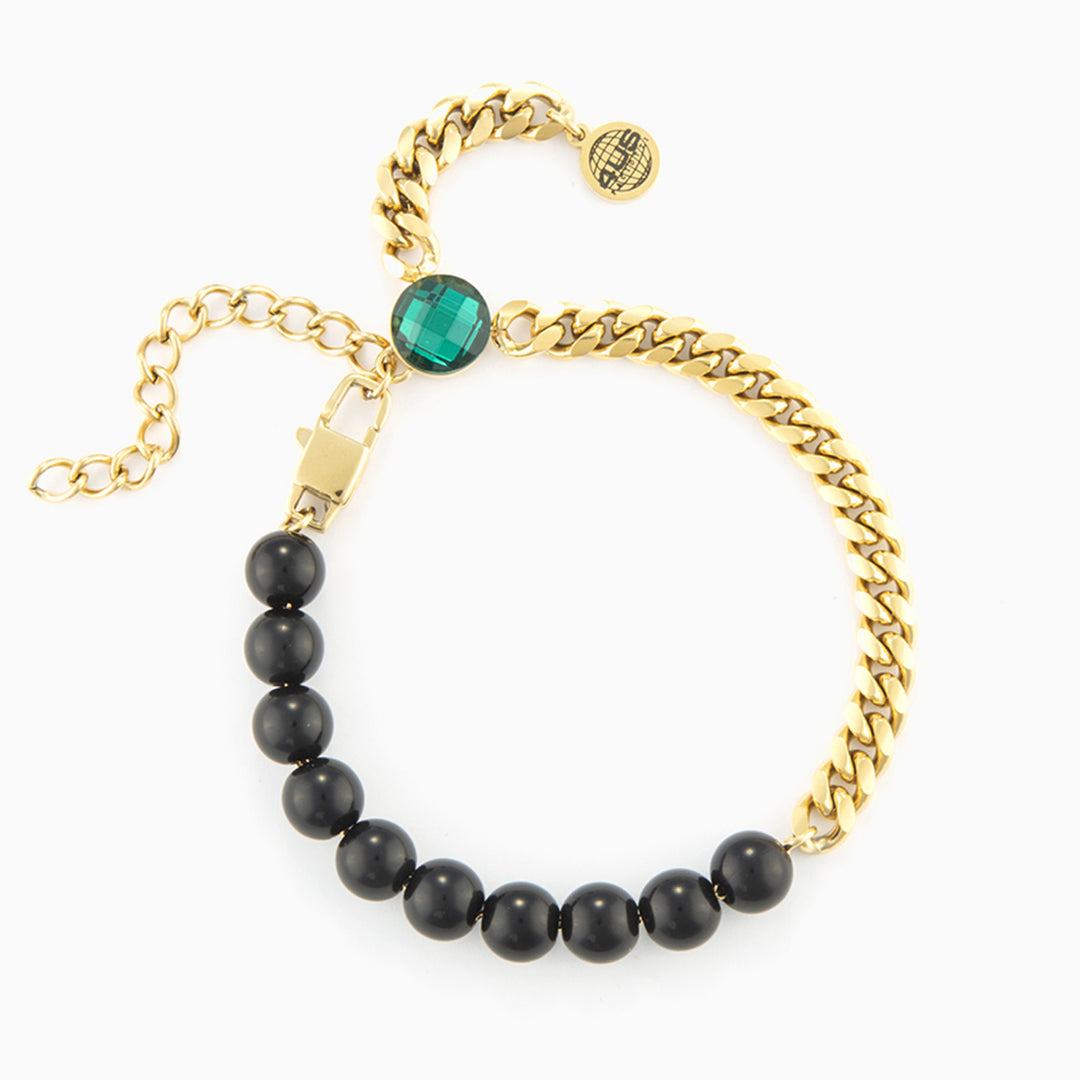 Bracciale con catena dorata, pietre nere e cristallo verde